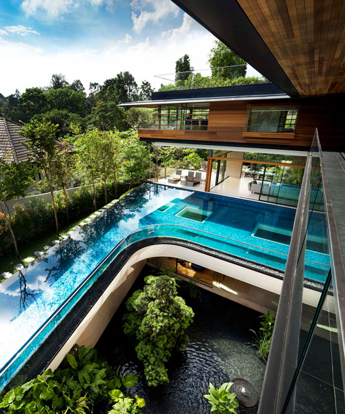 guz architects cantilevers the botanica house over the lush nature of singapore