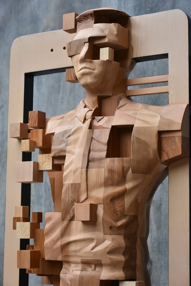 han hsu-tung crafts intricate pixelated sculptures made of wood