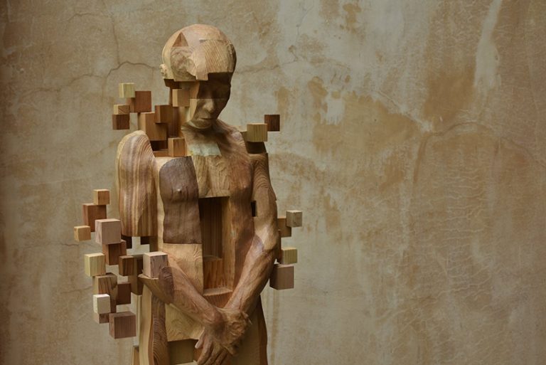 han hsu-tung crafts intricate pixelated sculptures made of wood