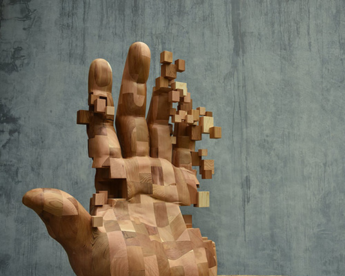 han hsu-tung crafts intricate pixelated sculptures made of wood