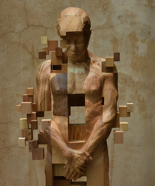 han hsu-tung crafts intricate pixelated sculptures made of wood