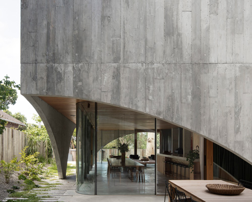 edition office combines pair of arched concrete shells for house in hawthorn, australia