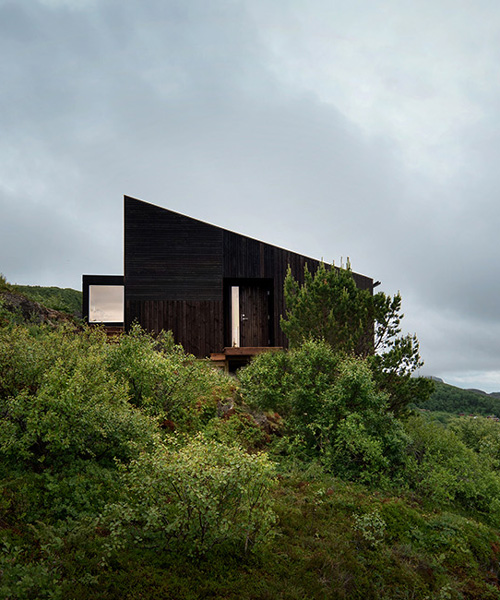 kappland arkitekter places cabin on steep, seaside slope in norwegian island