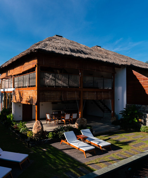 D1 builds duplex villa in vietnam with local materials and a coconut leaf roof