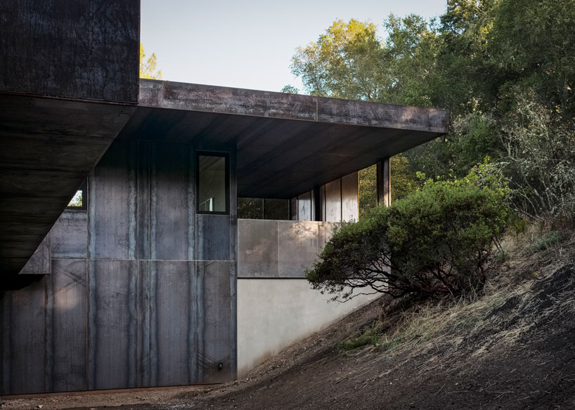 zero-net energy miner road residence wrapped in rainscreen of corten steel