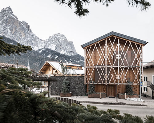 noa* designs traditional alpine mountain home with unexpected interior spaces
