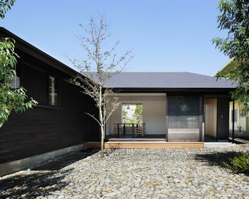 n.yamada architect and associates clads japanese residence in dark cedar exterior