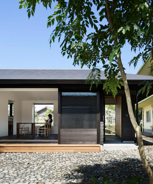 n.yamada architect and associates clads japanese residence in dark cedar exterior