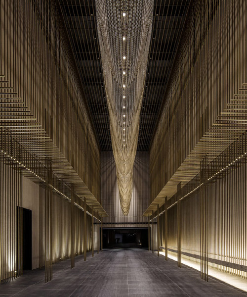 the oval partnership installs 8000 bronze flutes inside a theater in china