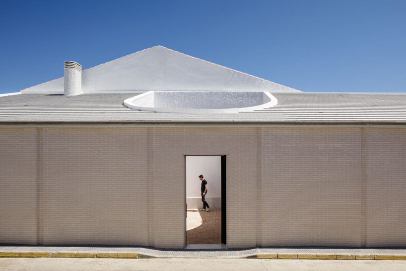 studio wet constructs family house with 40-meter-long brick façade in alosno, spain
