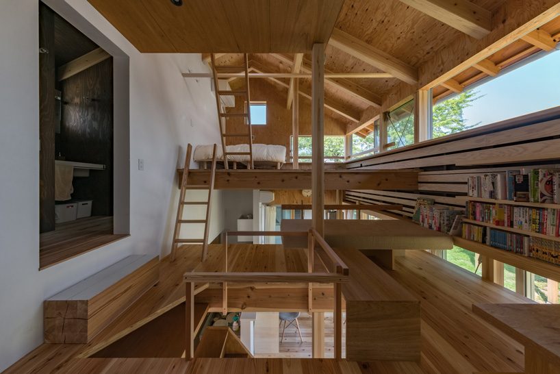 yoneda completes shed-like house in rural japan with intricate wooden interiors