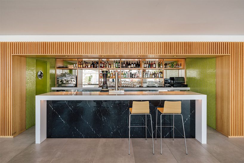 zooco estudio's flamingo club hotel in tenerife combines bamboo, basalt stone + white hues