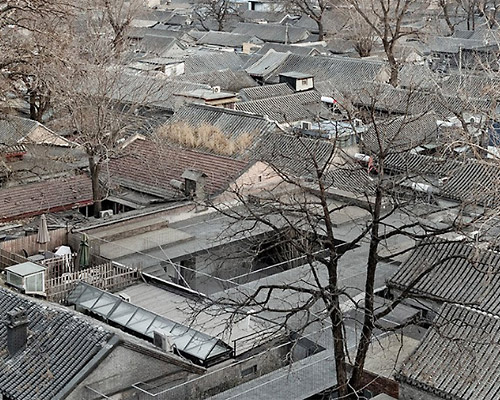 archstudio folds open courtyard into small residence in beijing