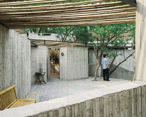 DL atelier uses bamboo-formed concrete walls to divide hotel courtyard in china