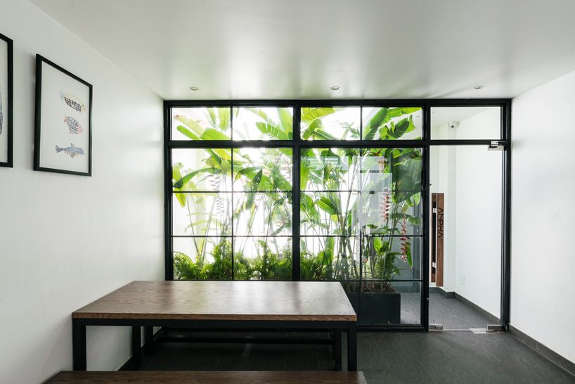 AD9 architects clads vietnamese office building in dynamic façade and greenery