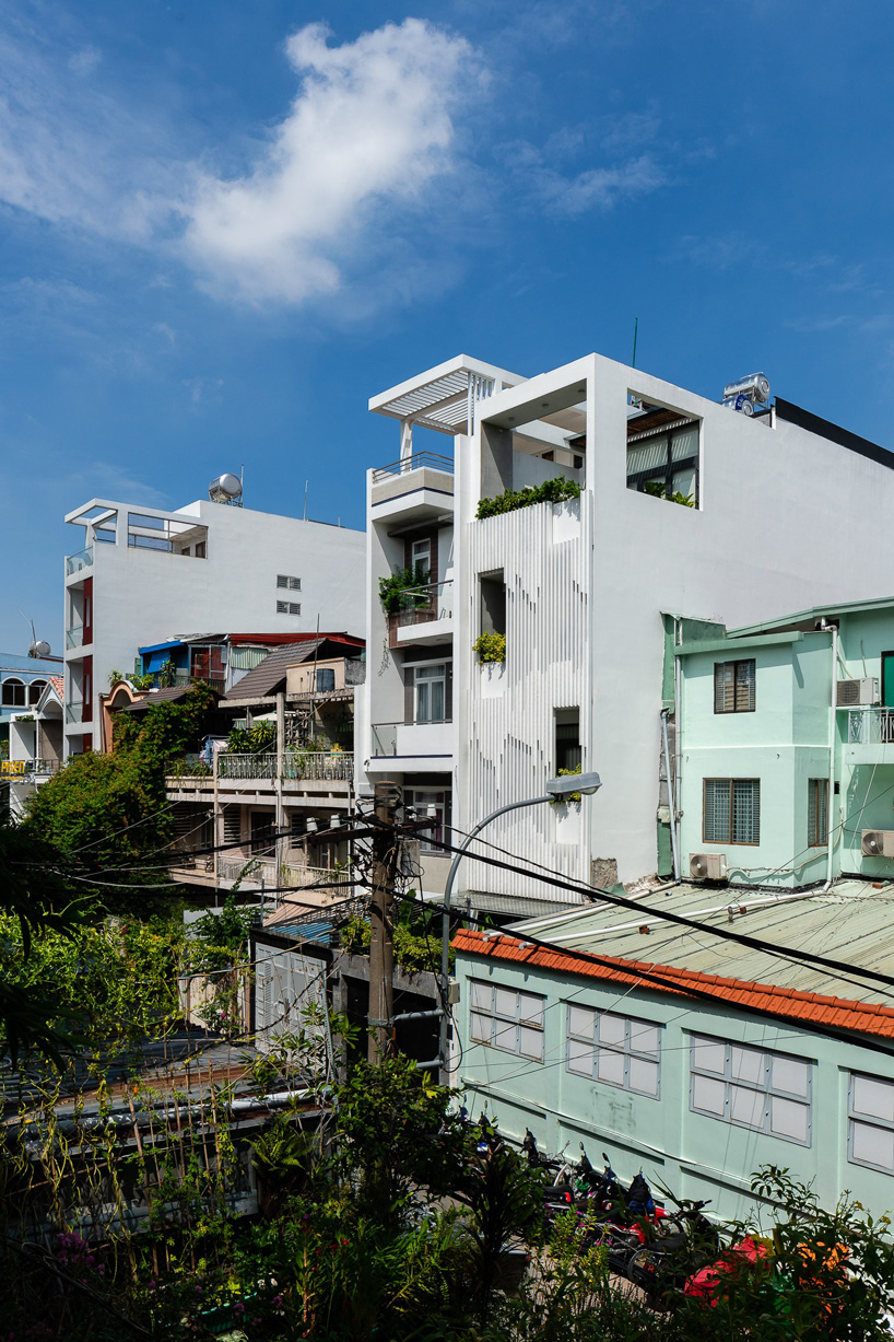 aD9 architects clads vietnamese office building in dynamic façade and greenery