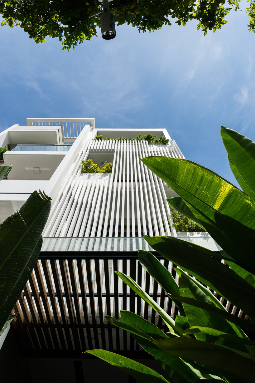 AD9 architects clads vietnamese office building in dynamic façade and greenery