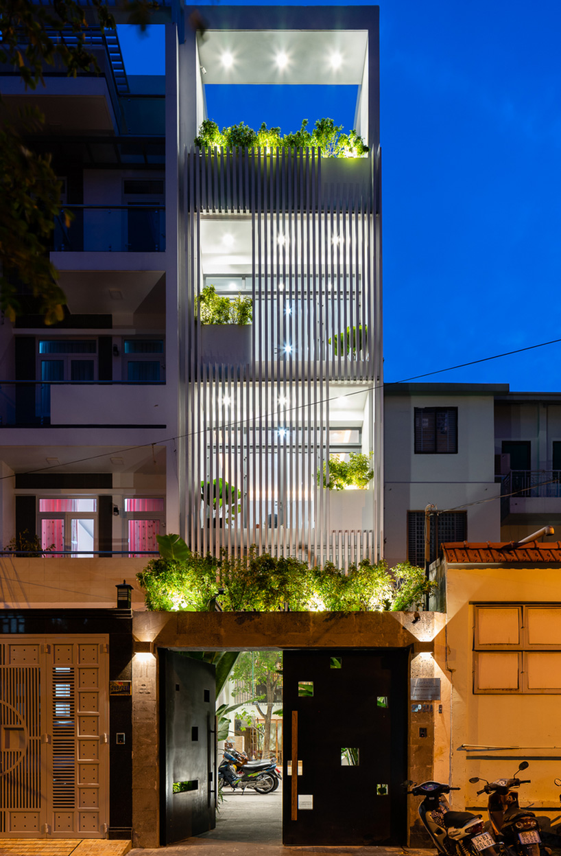 AD9 architects clads vietnamese office building in dynamic façade and greenery