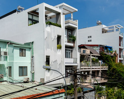 AD9 architects clads vietnamese office building in dynamic façade and greenery