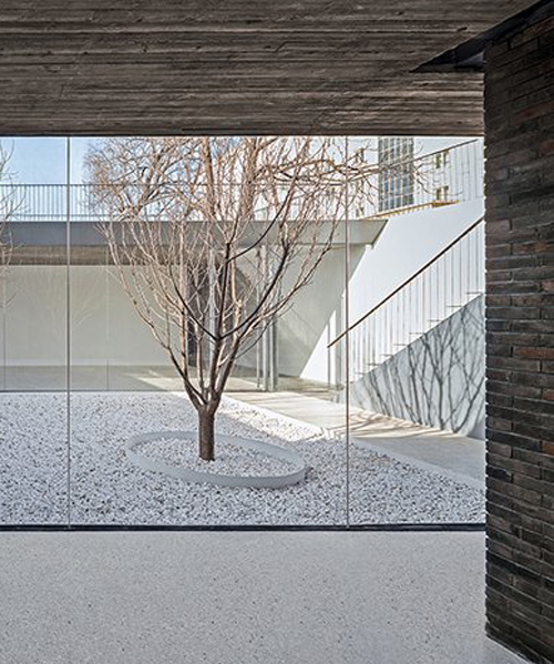 archstudio folds open courtyard into small residence in beijing