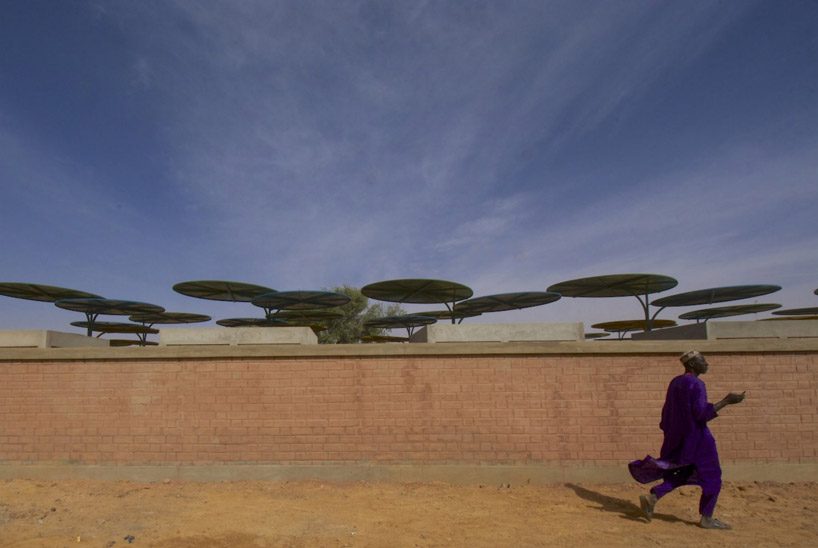atelier masōmī uses colorful metal canopies to build dandaji market in niger