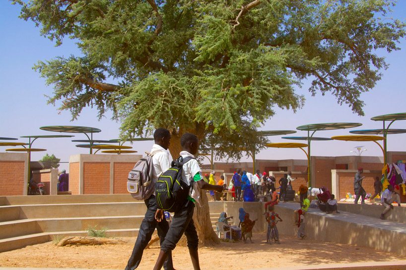 atelier masōmī uses colorful metal canopies to build dandaji market in niger