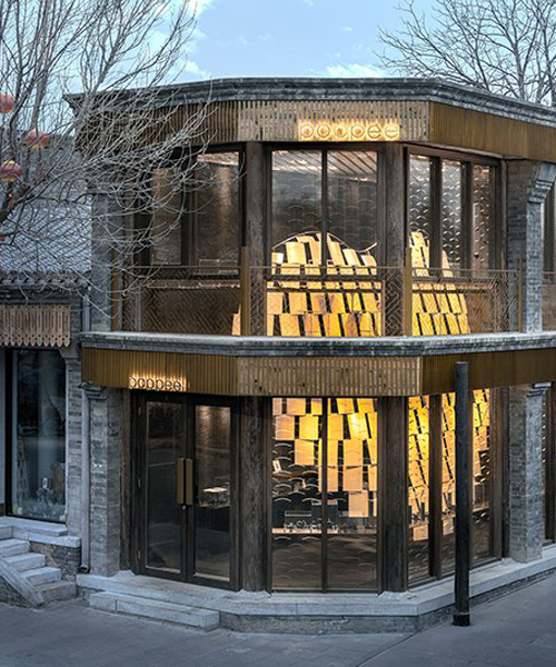 atelier tree brings life to beijing storefront with golden heart installation