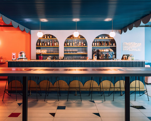 biancoebianca combines soft shapes with colorful terrazo in dramatic romanian restaurant