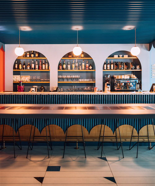 biancoebianca combines soft shapes with colorful terrazo in dramatic romanian restaurant