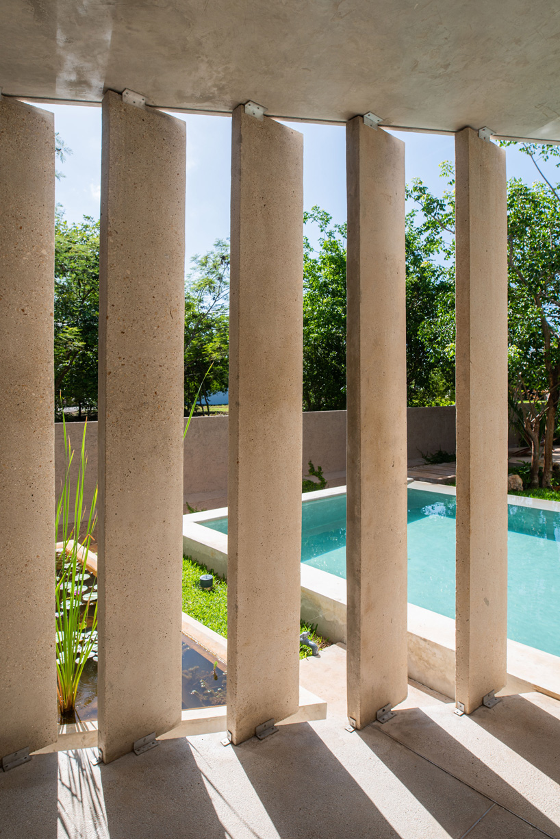 TACO sets concrete 'casa del lago' house by a lake in merida, mexico