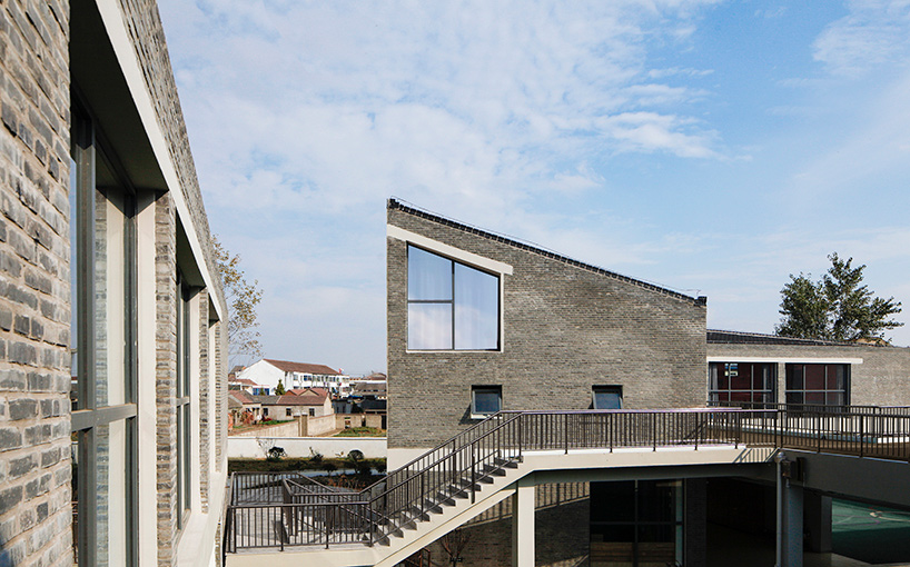crossboundaries designs network of buildings to form village-like kindergarten in rural china