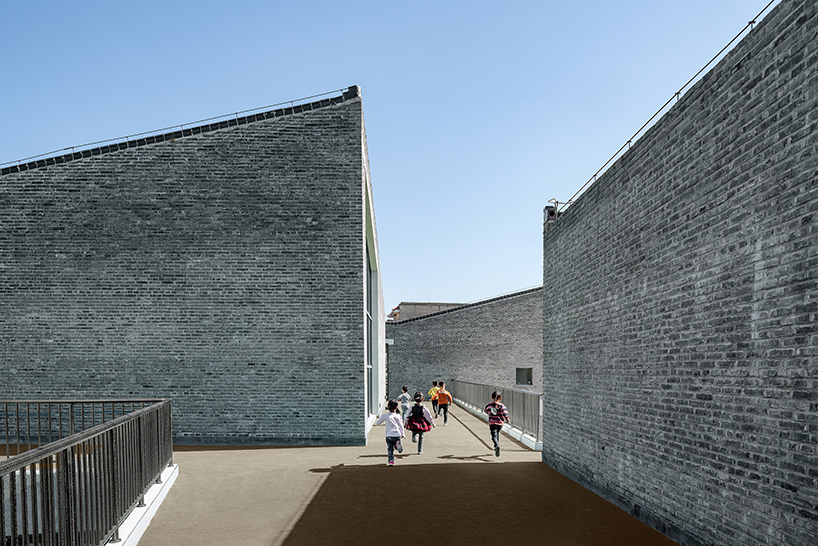 crossboundaries designs network of buildings to form village-like kindergarten in rural china