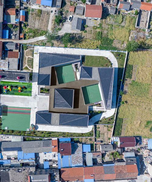 crossboundaries designs network of buildings to form village-like kindergarten in rural china