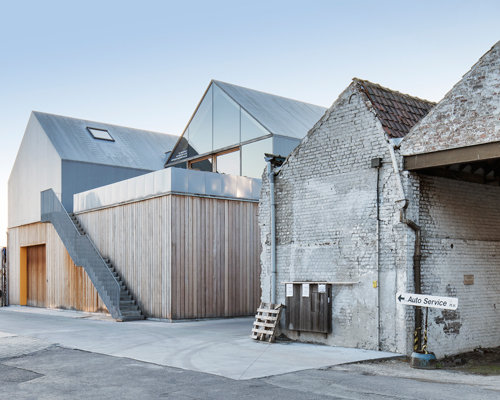 delmulle delmulle architecten constructs houses inside factory roofs in belgium