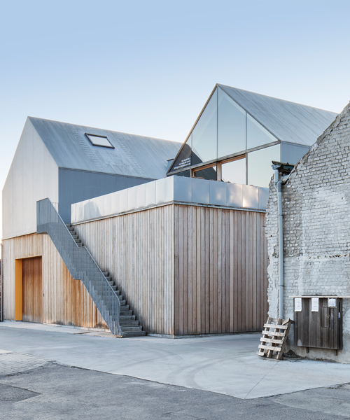 delmulle delmulle architecten constructs houses inside factory roofs in belgium