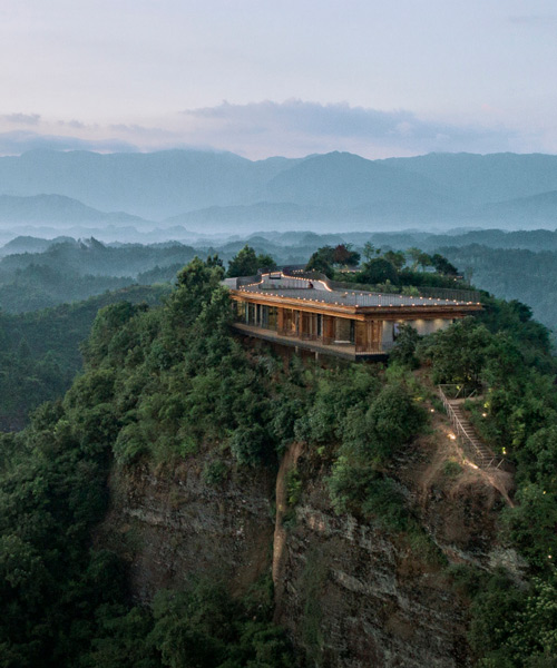 mountaintop hotel in china offers views across a landscape of rivers, forests, and hills
