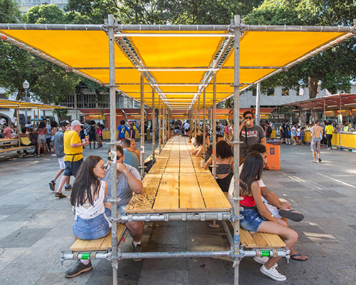 estúdio chão utilizes scaffolding to build temporary structures for festival in rio de janeiro