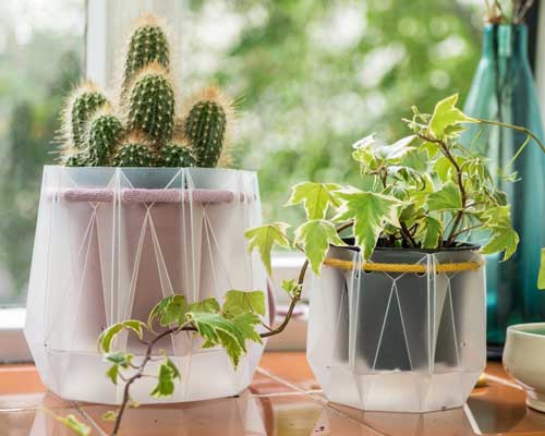 flatpack origami plant pots are eco-friendly and water themselves
