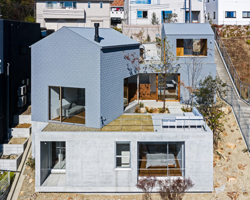 geo-graphic design lab stacks huts on a slope for family residence in takarazuka, japan
