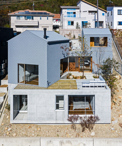geo-graphic design lab stacks huts on a slope for family residence in takarazuka, japan