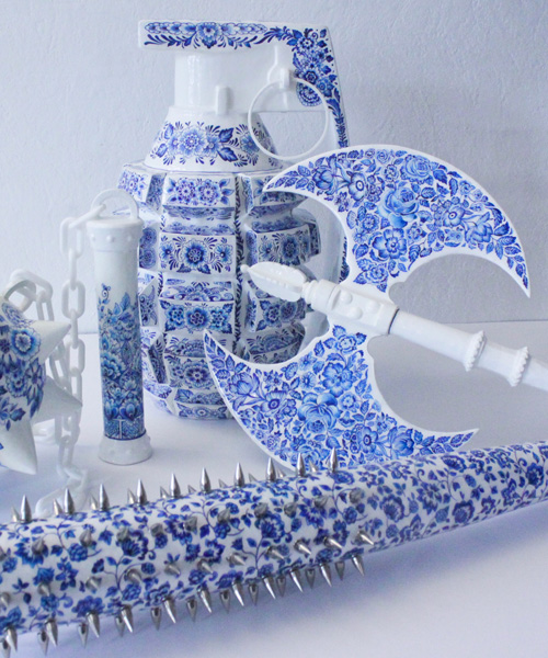 helena hauss hand paints ceramic weapons in delft blue style to champion female fierceness