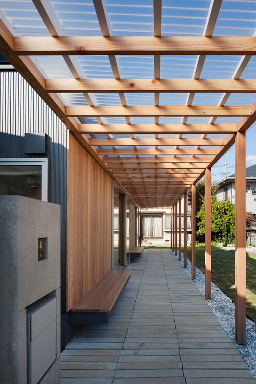 IN studio builds wooden 'cultivatable' house for family of farmers in japan