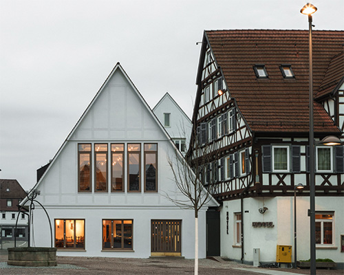 ko/ok architektur and studio beradi adds contemporary restaurant to historical german inn