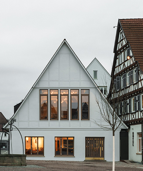 ko/ok architektur and studio beradi adds contemporary restaurant to historical german inn