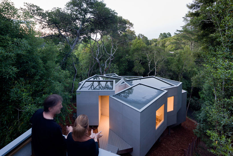 the mill valley house cascades down the side of a steep hill in california