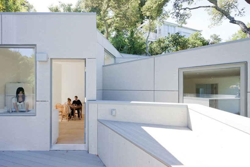 the mill valley house cascades down the side of a steep hill in california