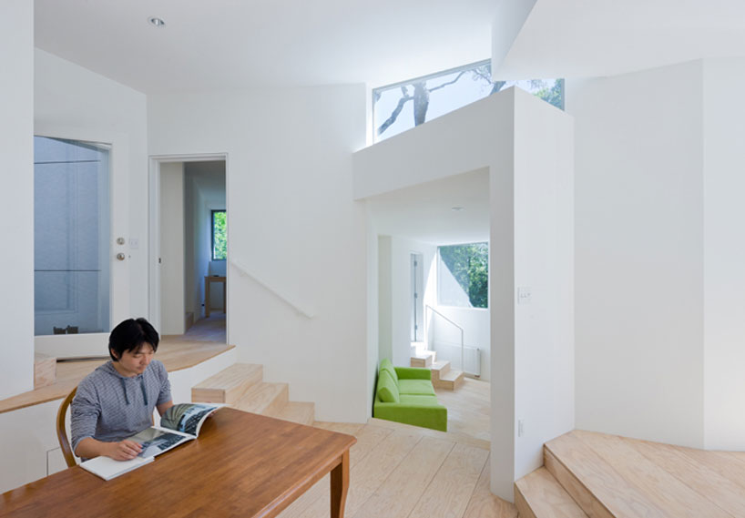 the mill valley house cascades down the side of a steep hill in california