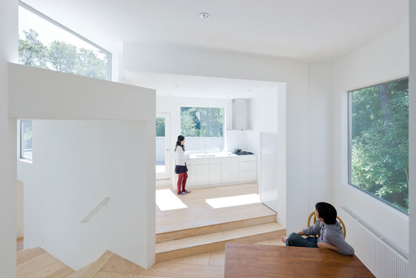 the mill valley house cascades down the side of a steep hill in california