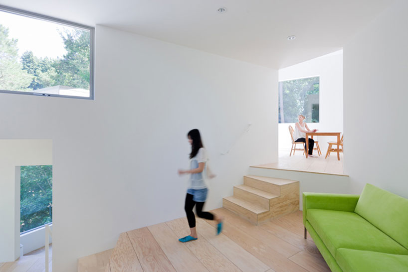 the mill valley house cascades down the side of a steep hill in california