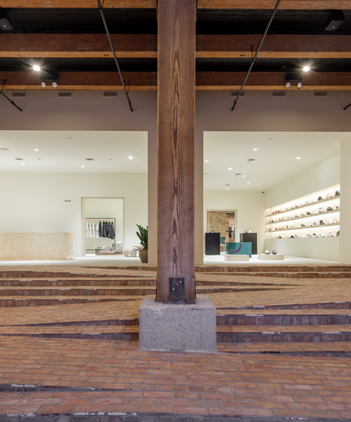 norman kelley remodels 'notre' store in chicago with a multi-purpose stair-ramp